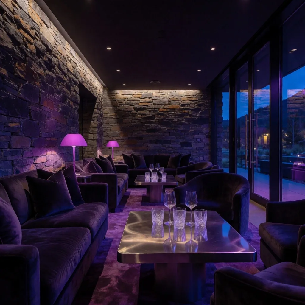 Rosemont Haven Queenstown lounge interior at night with crystal glassware and violet neon accents